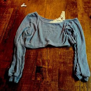 A long sleeve crop top shirt.